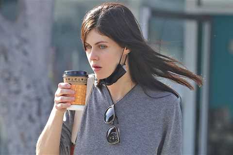 Alexandra Daddario sips a coffee while running errands
