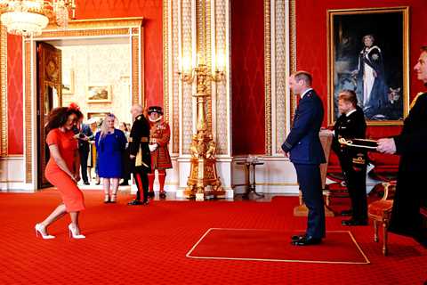Giddy Mel B beams as she curtsies to Prince William while receiving MBE in front of proud mum