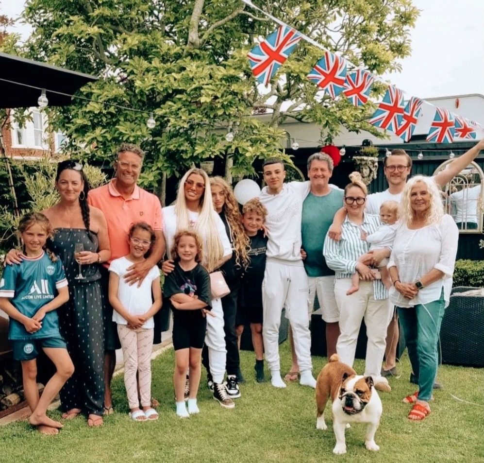 Katie Price poses with Junior, Princess, Jett and Bunny in adorable family picture as she toasts the Queen