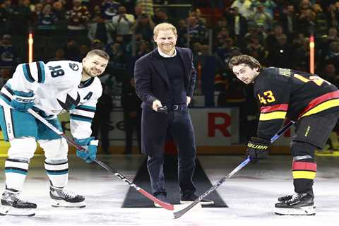 Prince Harry told to drop hockey puck by star as he's too busy smiling for photos