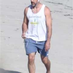 Aaron Rodgers enjoys solo beach walk as mystery wife remains out of sight