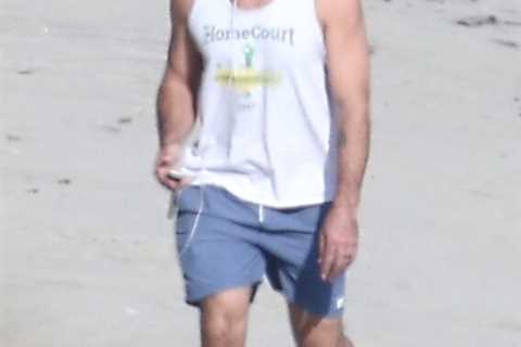 Aaron Rodgers enjoys solo beach walk as mystery wife remains out of sight