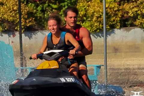 Sydney Sweeney Rides Jet Ski on Lake With Mystery Man Wrapped Around Her
