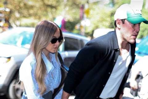 Sydney Sweeney Looks All Business in Short Skirt, Holds Scooter Braun's Hand