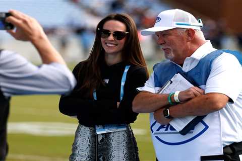 Jordon Hudson poses for photos on sideline before North Carolina’s crushing loss