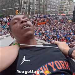 Chaotic moment Knicks fans climb structure to save reveler from apparent overdose during..