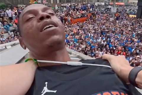 Chaotic moment Knicks fans climb structure to save reveler from apparent overdose during..