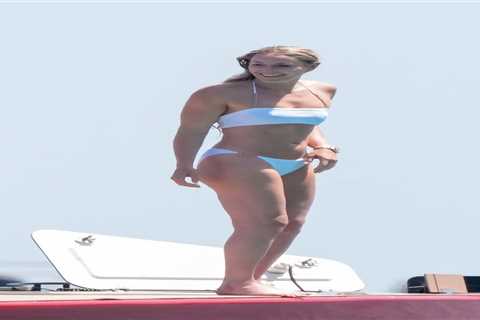 Bikini-clad Lindsey Vonn shows off her injured leg on yacht four months after horror crash