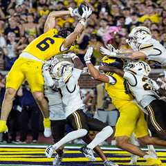 Michigan wins on second Hail Mary pass in controversial ending to avoid brutal upset